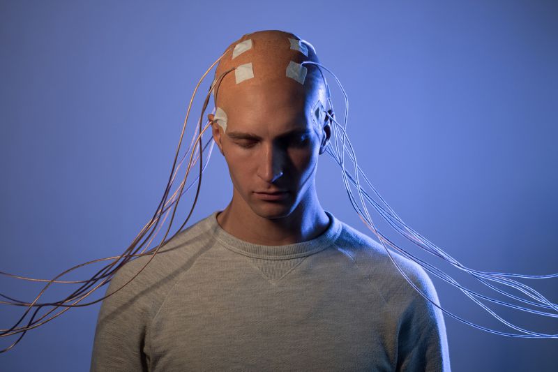 Human with electrodes attached to his head
