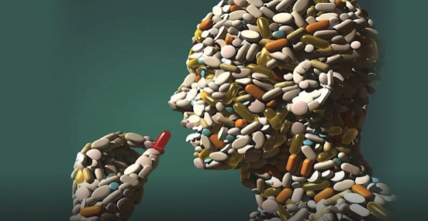 Image of a person made of pills, taking a pill