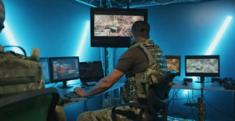Depicting DOD soldier monitoring computer screens