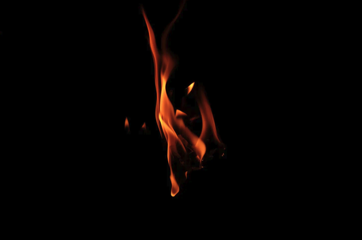 Image of a flame in the middle of the darkness