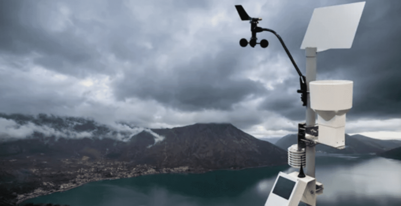 Thumbnail from America Out Loud Pulse post with weather station overlooking at the water and mountain